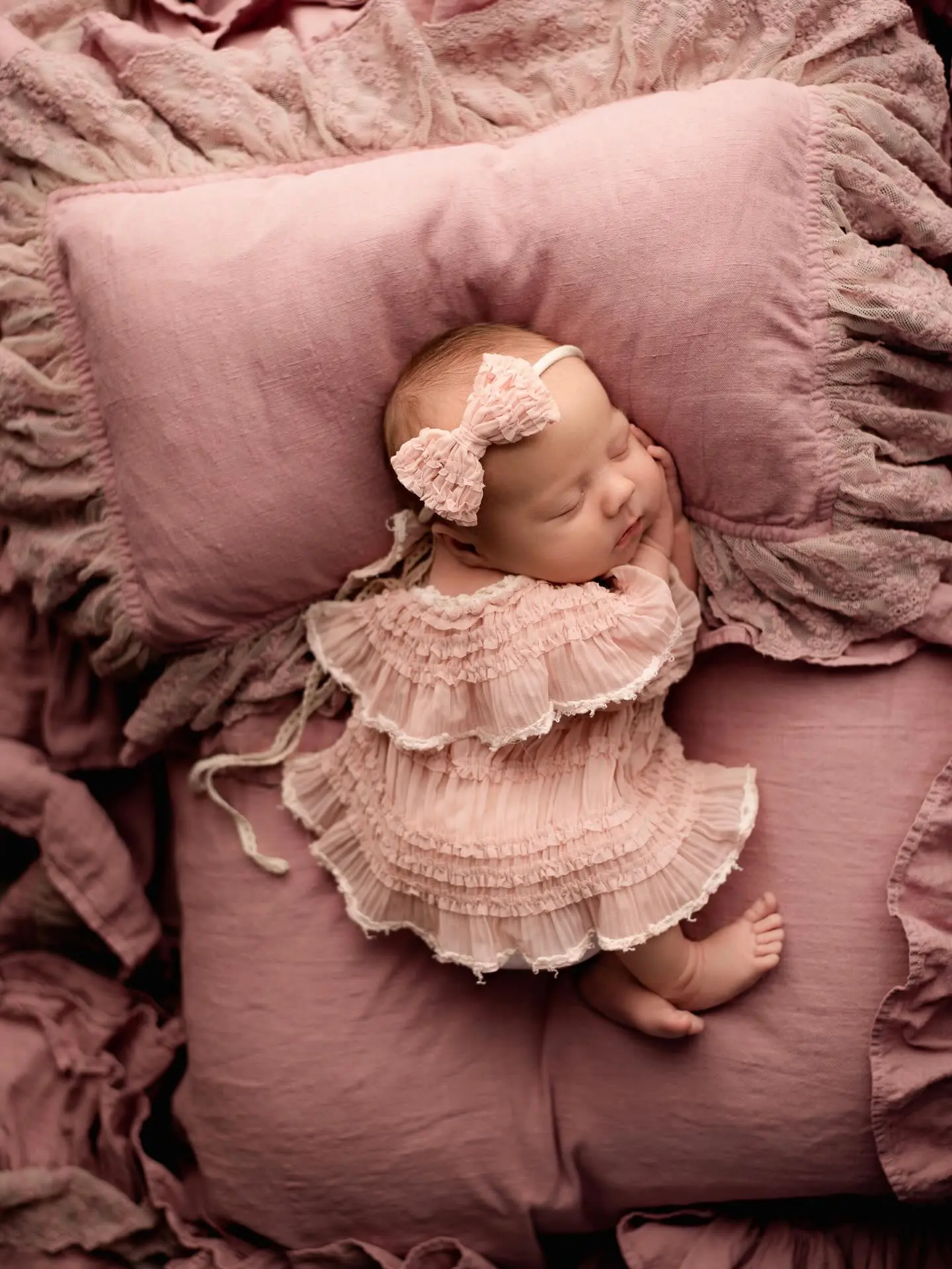 Baby in vintage basket with floral headband