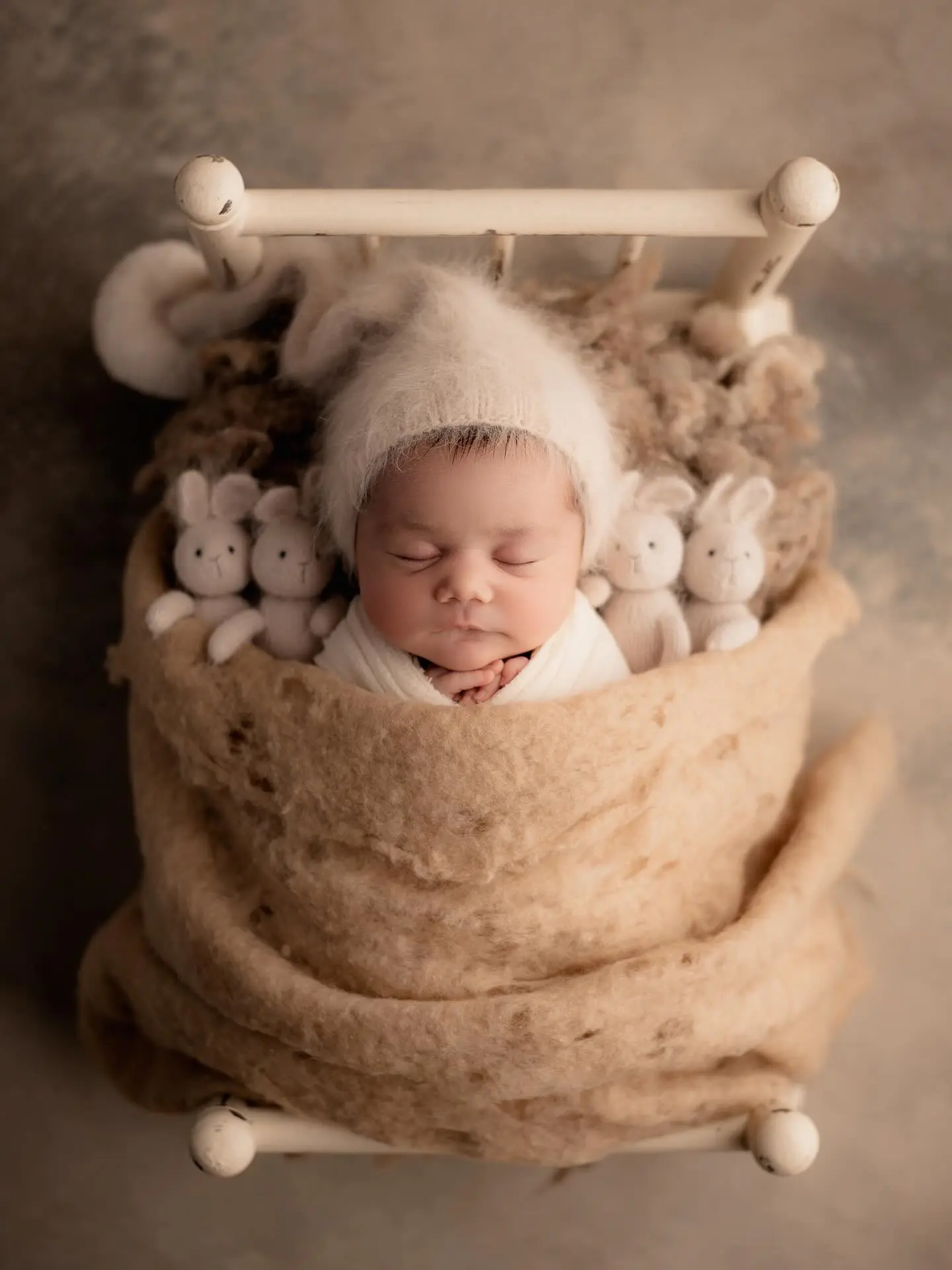 Newborn wrapped in mohair blanket